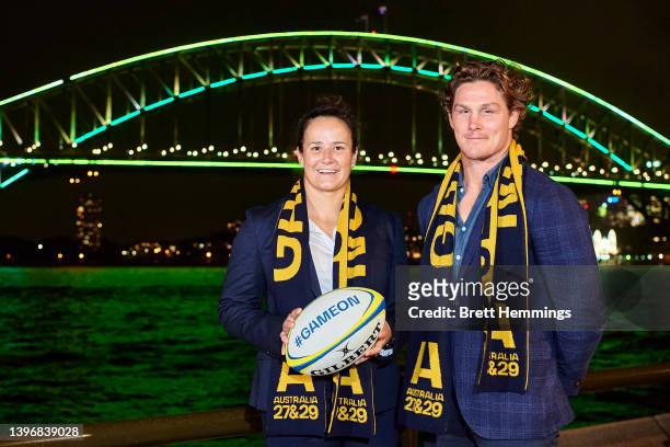 Michael Hooper and Shannon Parry pose for a photo in front of The Sydney Harbour Bridge, lit in support of Rugby Australia's 2027 & 2029 Rugby World...