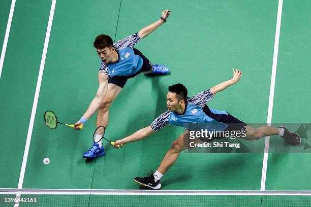 Lee Yang and Wang Chi-Lin of Chinese Taipei compete in the Men's Double match against Takuro Hoki and Yugo Kobayashi of Japan during day five of the...