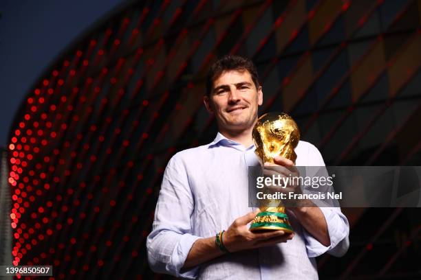 Iker Casillas, FIFA World Cup Trophy Tour Ambassador poses for picture with the Original FIFA World Cup Trophy at Coca-Cola Arena on May 11, 2022 in...