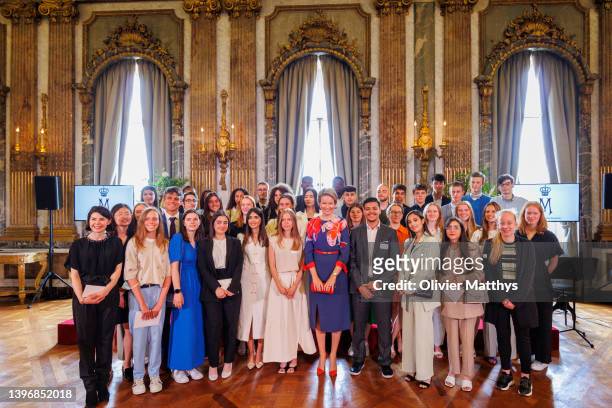 Queen Mathilde of Belgium poses with the finalists of the Queen Mathilde Fund prize ISEE/IDEA/IDO, at the Royal Palace on May 12, 2022 in Brussels,...
