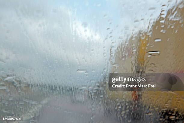 passing an dhl truck at the highway - nürnberg rainy stock pictures, royalty-free photos & images