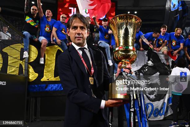 Head Coach Simone Inzaghi of FC Internazionale celebrate with the trophy after winning the oppa Italia Final match between Juventus and FC...