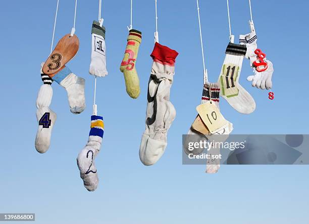 art crafted mobile against blue sky - sock stock pictures, royalty-free photos & images