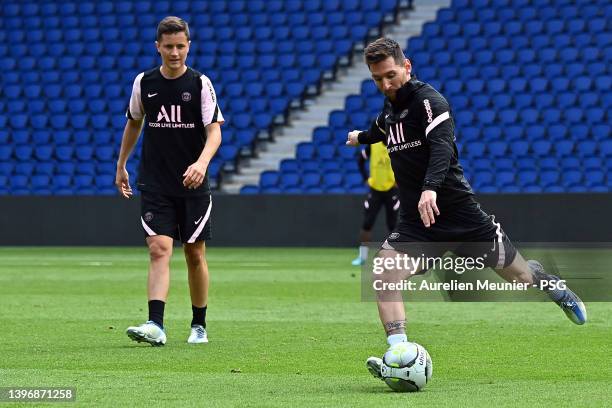 Leo Messi kicks the ball during a Paris Saint-Germain training session at Parc des Princes on May 12, 2022 in Paris, France.