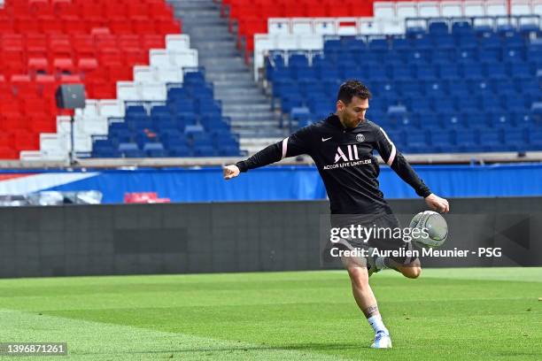 Leo Messi kicks the ball during a Paris Saint-Germain training session at Parc des Princes on May 12, 2022 in Paris, France.