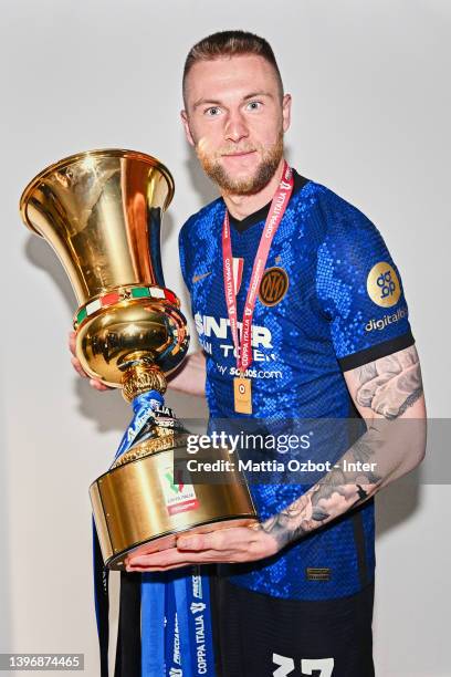 Milan Skriniar of FC Internazionale pose with a trophy after winning the Coppa Italia Final match between Juventus and FC Internazionale at Stadio...