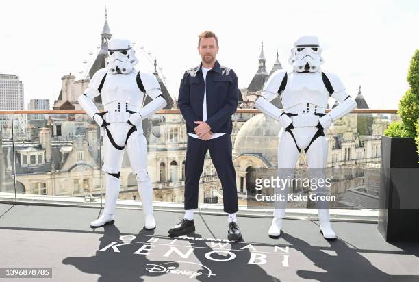Ewan McGregor poses with Stormtroopers as he attends the "Obi-Wan Kenobi" photocall at the Corinthia Hotel London on May 12, 2022 in London, England.
