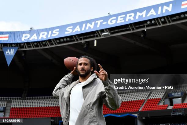 Colin Kaerpernick throws a football as he attends a Paris Saint-Germain training session at Parc des Princes on May 12, 2022 in Paris, France.