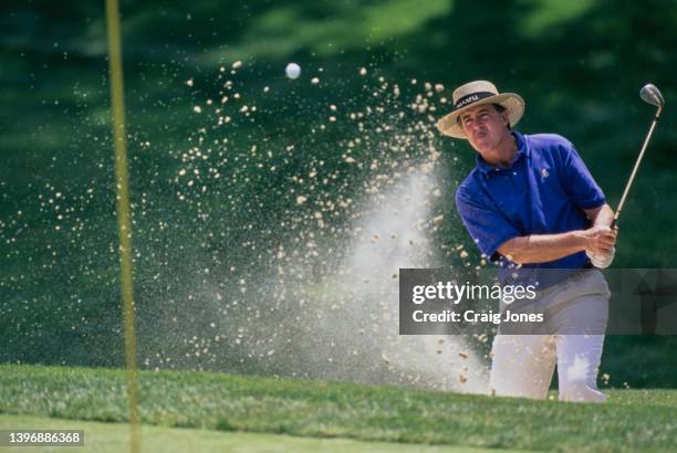 Trevor Dodds from Namibia watches on his chip shot out of the sand bunker to the green during the PGA The Memorial Tournament on 28th May 1998 at the...