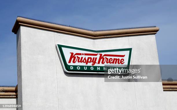 Sign is posted in the exterior of a Krispy Kreme doughnut store on May 12, 2022 in Daly City, California. Krispy Kreme reported strong first quarter...
