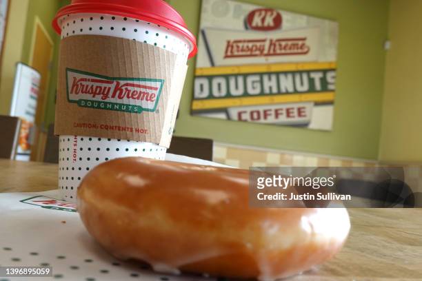 In this photo illustration, a Krispy Kreme glazed doughnut is shown on May 12, 2022 in Daly City, California. Krispy Kreme reported strong first...