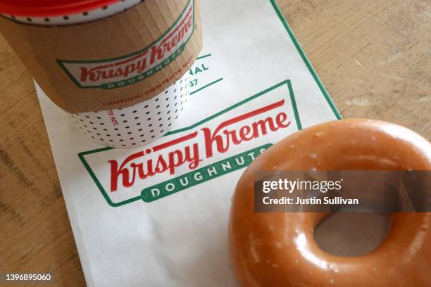 In this photo illustration, a Krispy Kreme glazed doughnut is shown on May 12, 2022 in Daly City, California. Krispy Kreme reported strong first...