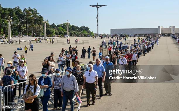 Pilgrims participate of the Eucharistic procession from the Basilica of the Most Holy Trinity to the Altar of the Prayer Site in the Sanctuary of...