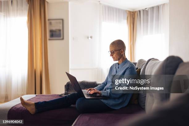 woman living with cancer, working at home - business enterprise survival endurance stock pictures, royalty-free photos & images