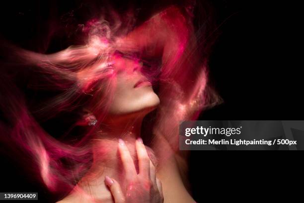 light painting portrait of woman with red hair,russia - red light portrait stock pictures, royalty-free photos & images