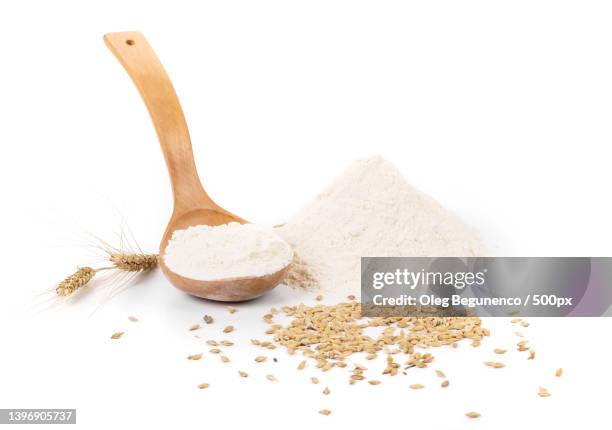 wood spoon with eggs and flour against white background,moldova - oat ear stock pictures, royalty-free photos & images