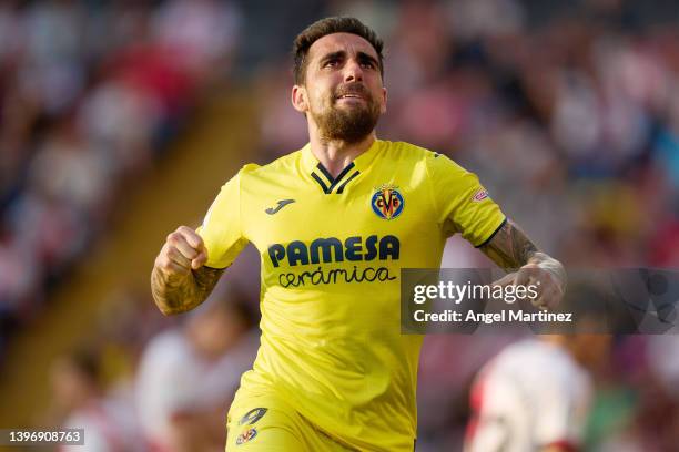 Paco Alcacer of Villarreal CF celebrates after scoring their side's third goal during the La Liga Santander match between Rayo Vallecano and...