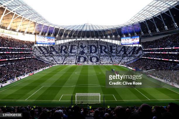 General view inside the stadium as fans hold up pieces of fabric to display a message of 'Dare Dream Do' prior to the Premier League match between...