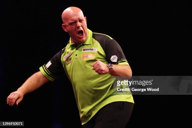 Michael van Gerwen of Netherlands celebrates during their match against Peter Wright of Scotland on night 14 of the Cazoo Premier League Darts at...