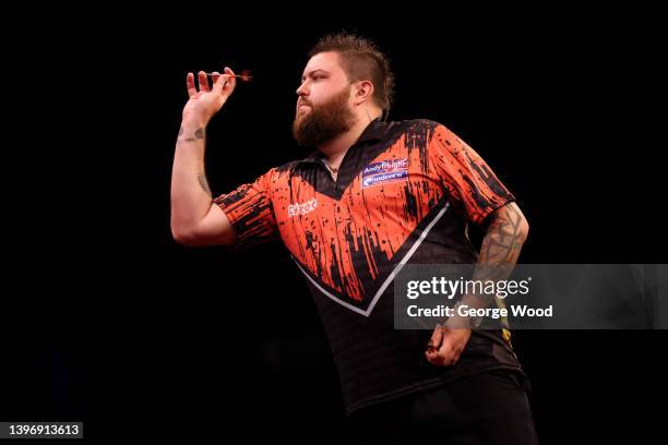 Michael Smith of England competes during their match against Jonny Clayton of Wales on night 14 of the Cazoo Premier League Darts at Utilita Area...