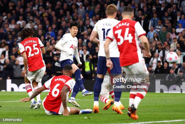 Heung-Min Son of Tottenham Hotspur scores their side's third goal during the Premier League match between Tottenham Hotspur and Arsenal at Tottenham...