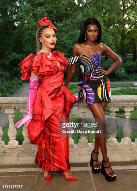 Munroe Bergdorf and Leomie Anderson attend the Jeremy Scott & Moschino launch of 'Moschino' by Assouline on May 12, 2022 in London, England.