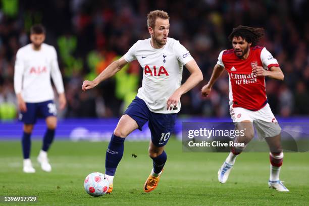 Harry Kane of Tottenham Hotspur battles for possession with Mohamed Elneny of Arsenal during the Premier League match between Tottenham Hotspur and...