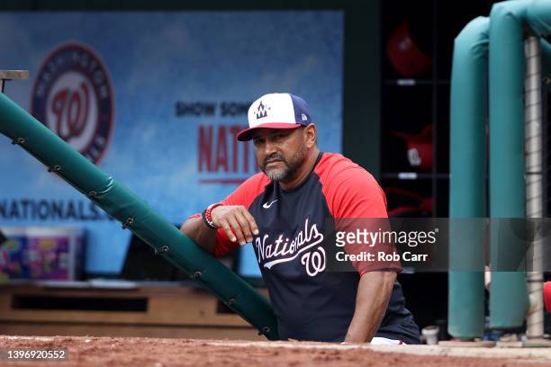 Manager Dave Martinez of the Washington Nationals looks on from the dugout during the ninth inning of the Nationals 4-1 loss to the New York Mets at...