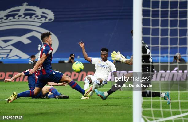 Vinicius Junior of Real Madrid scores their side's fourth goal during the La Liga Santander match between Real Madrid CF and Levante UD at Estadio...