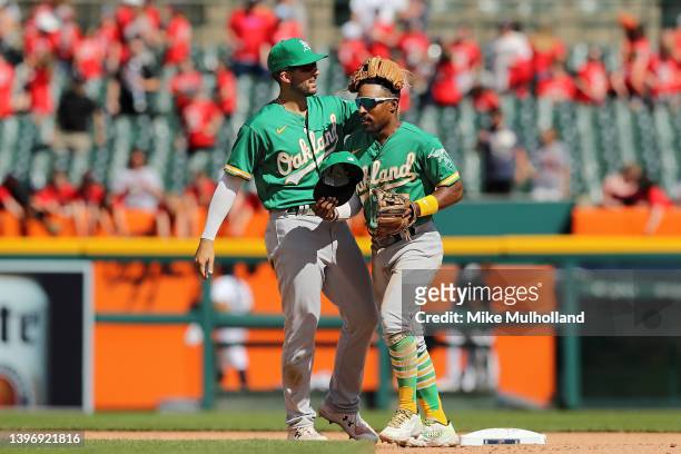 Tony Kemp of the Oakland Athletics and Kevin Smith celebrate after defeating the Detroit Tigers, 5-3, at Comerica Park on May 12, 2022 in Detroit,...
