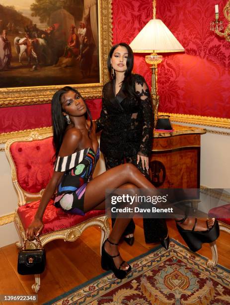 Leomie Anderson and Mabel attend the Jeremy Scott & Moschino launch of 'Moschino' by Assouline on May 12, 2022 in London, England.