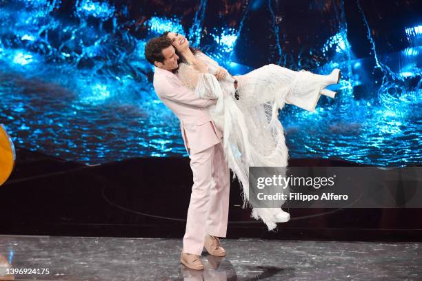 Mika and Laura Pausini are seen on stage during the second semi-final of the 66th Eurovision Song Contest at Pala Alpitour on May 12, 2022 in Turin,...