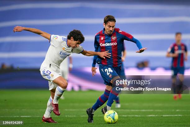 Jesus Vallejo of Real Madrid CF competes for the ball with Campana of Levante UD during the LaLiga Santander match between Real Madrid CF and Levante...