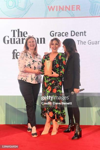 Grace Dent is presented with the Restaurant Writer Award by Angela Hartnett and Claudia Winkleman at the Fortnum & Mason Food and Drink Awards at The...