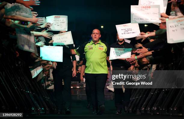 Michael van Gerwen of Netherlands walks out prior to their match against Gerwyn Price of Wales on night 14 of the Cazoo Premier League Darts at...