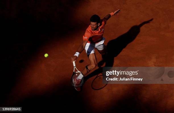 Novak Djokovic of Serbia plays a backhand against Stan Wawrinka of Switzerland during the Men's Singles Round 3 match on day five of Internazionali...