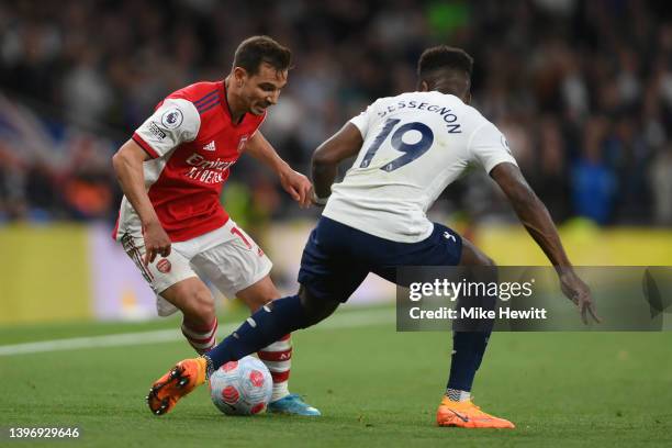 Cedric Soares of Arsenal is tackled by Ryan Sessegnon of Tottenham Hotspur during the Premier League match between Tottenham Hotspur and Arsenal at...