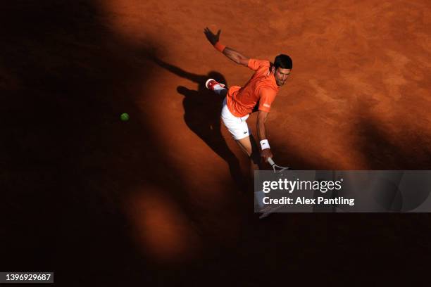 Novak Djokovic of Serbia plays a backhand in his men's singles third round match against Stan Wawrinka of Switzerland during day five of the...