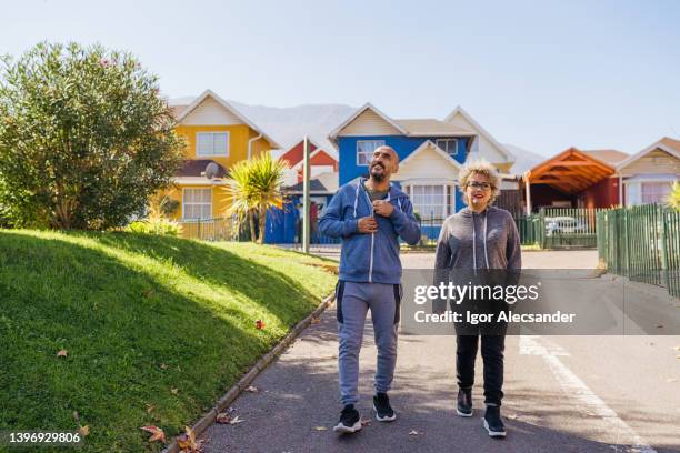 couple walking in the neighborhood - chilean ethnicity stock pictures, royalty-free photos & images