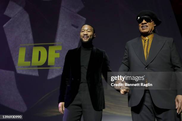 John Legend and Honoree Stevie Wonder are seen onstage during the LDF 34th National Equal Justice Awards Dinner on May 10, 2022 in New York City.