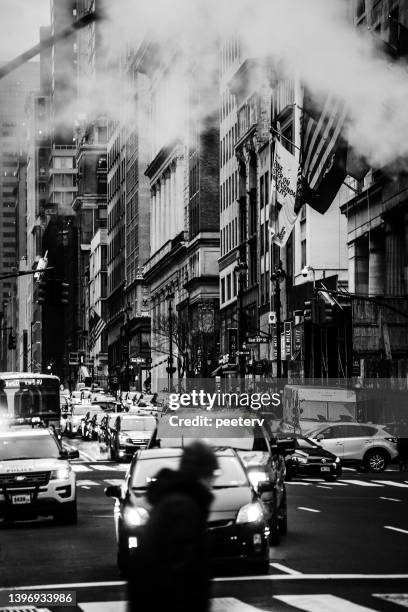 streets of manhattan, nyc - black and white taxi stock pictures, royalty-free photos & images