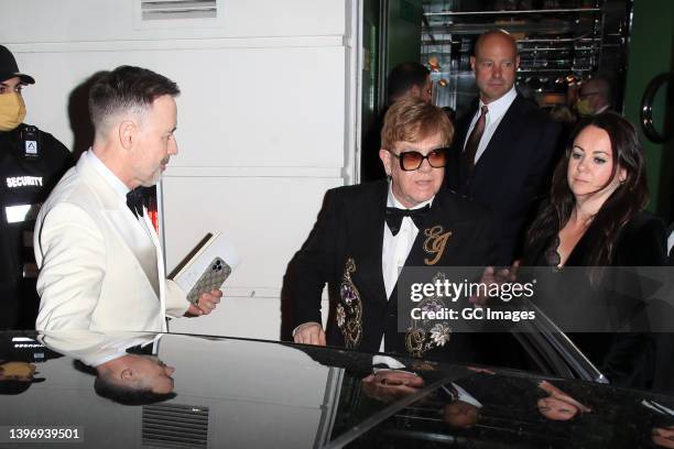 Elton John and David Furnish leave Annabel's for the Elton John AIDS Foundation Gala Benefit on May 12, 2022 in London, England.
