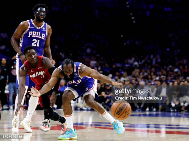 James Harden of the Philadelphia 76ers controls the ball against Victor Oladipo of the Miami Heat in Game Six of the 2022 NBA Playoffs Eastern...