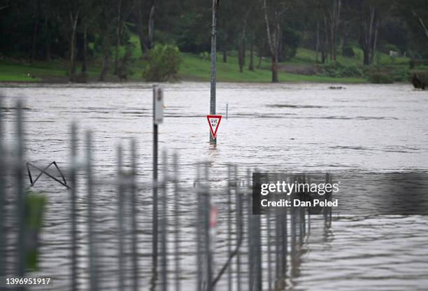 Road is inundated by floodwater on May 13, 2022 in Ipswich, Australia. Parts of southeast Queensland are on flood watch as the state continues to...