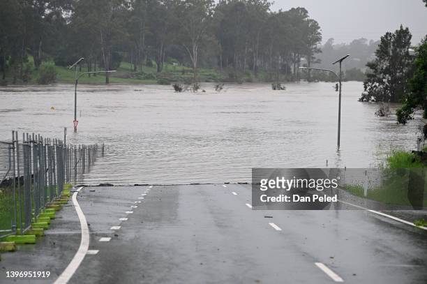 Road is cut off by floodwater on May 13, 2022 in Ipswich, Australia. Parts of southeast Queensland are on flood watch as the state continues to...
