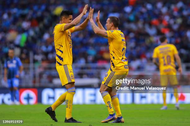 Jesus Dueñas of Tigres celebrates the first scored goal of Tigres with Hugo Ayala of Tigres during the quarterfinals first leg match between Cruz...