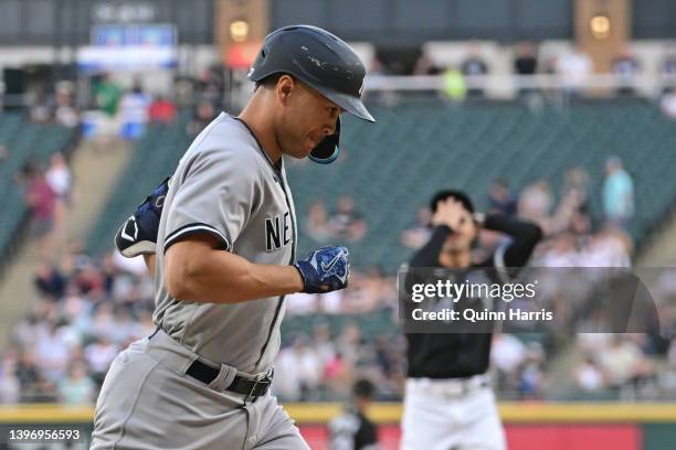 Giancarlo Stanton of the New York Yankees rounds the bases after hitting a two run home run in the first inning against the Chicago White Sox at...