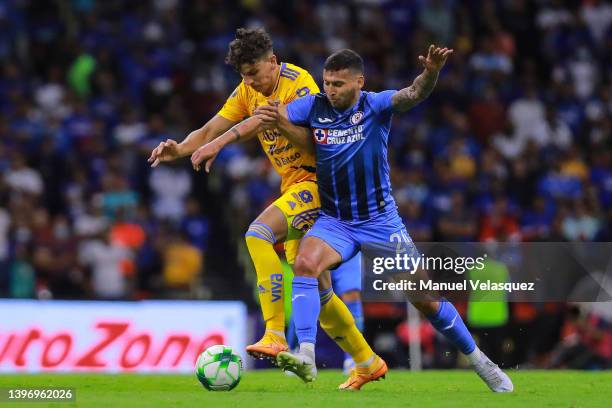 Igor Lichnovsky of Tigres battles for the ball against Juan Escobar of Cruz Azul during the quarterfinals first leg match between Cruz Azul and...