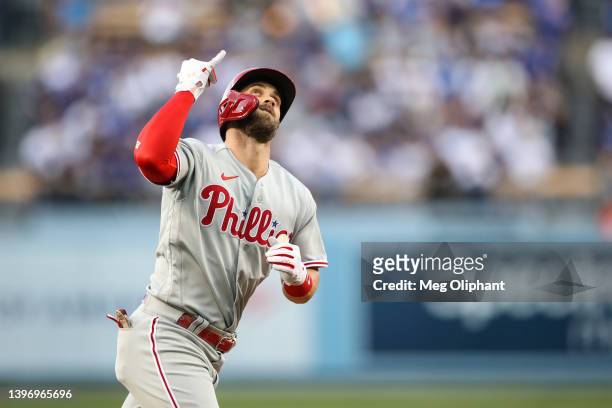 Bryce Harper of the Philadelphia Phillies reacts to his home run in the first inning against the Los Angeles Dodgers at Dodger Stadium on May 12,...