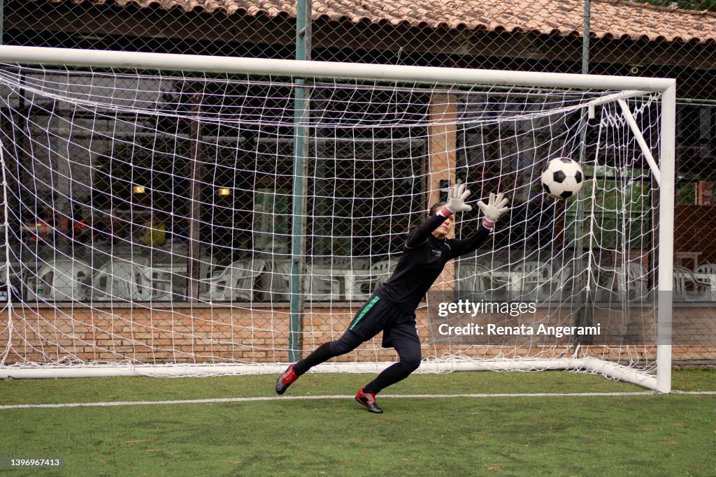 Female goalkeeper Catching the ball